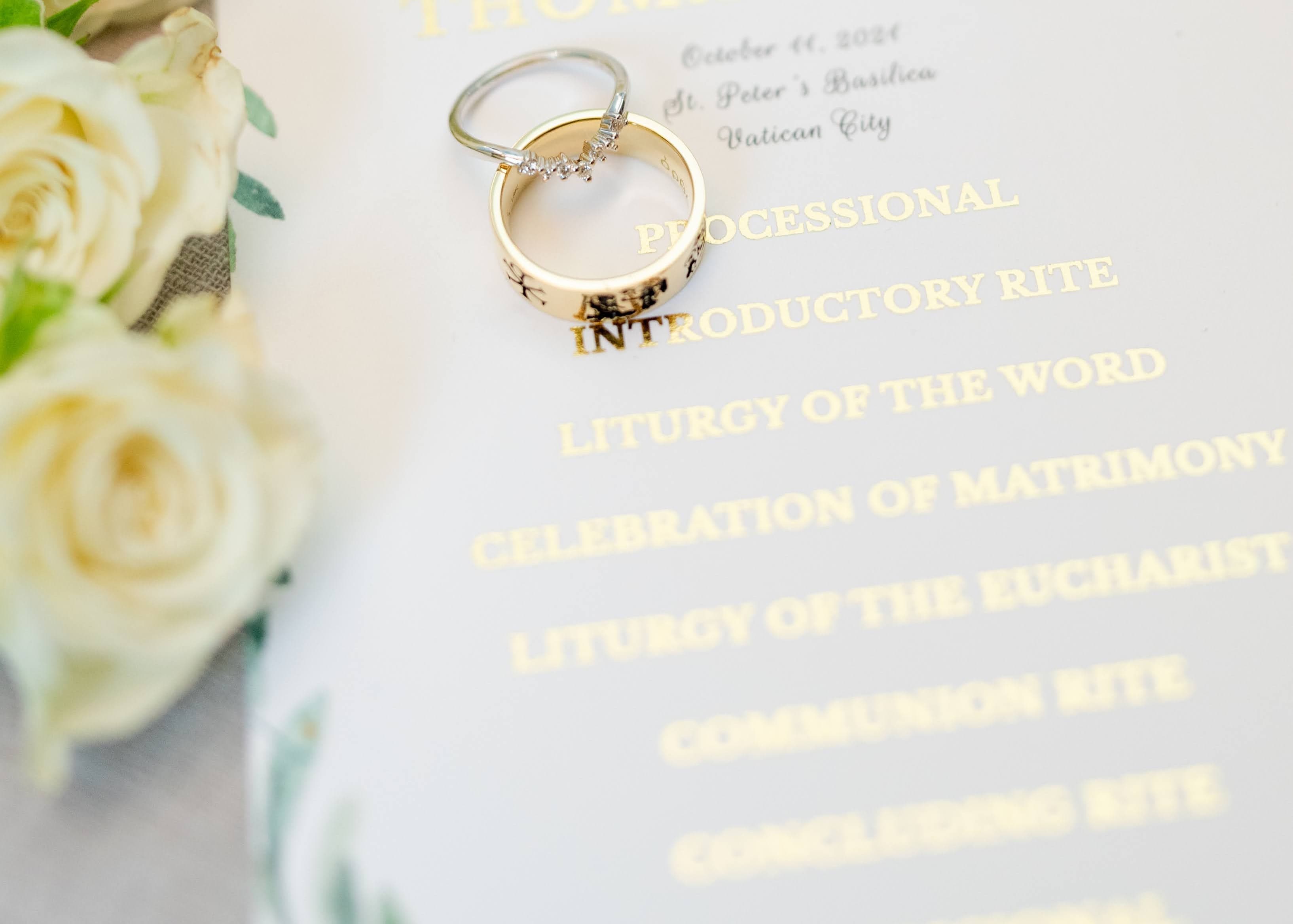 Wedding rings on a Catholic ceremony booklet